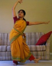 katakamukha hasta turned upwards above the head.